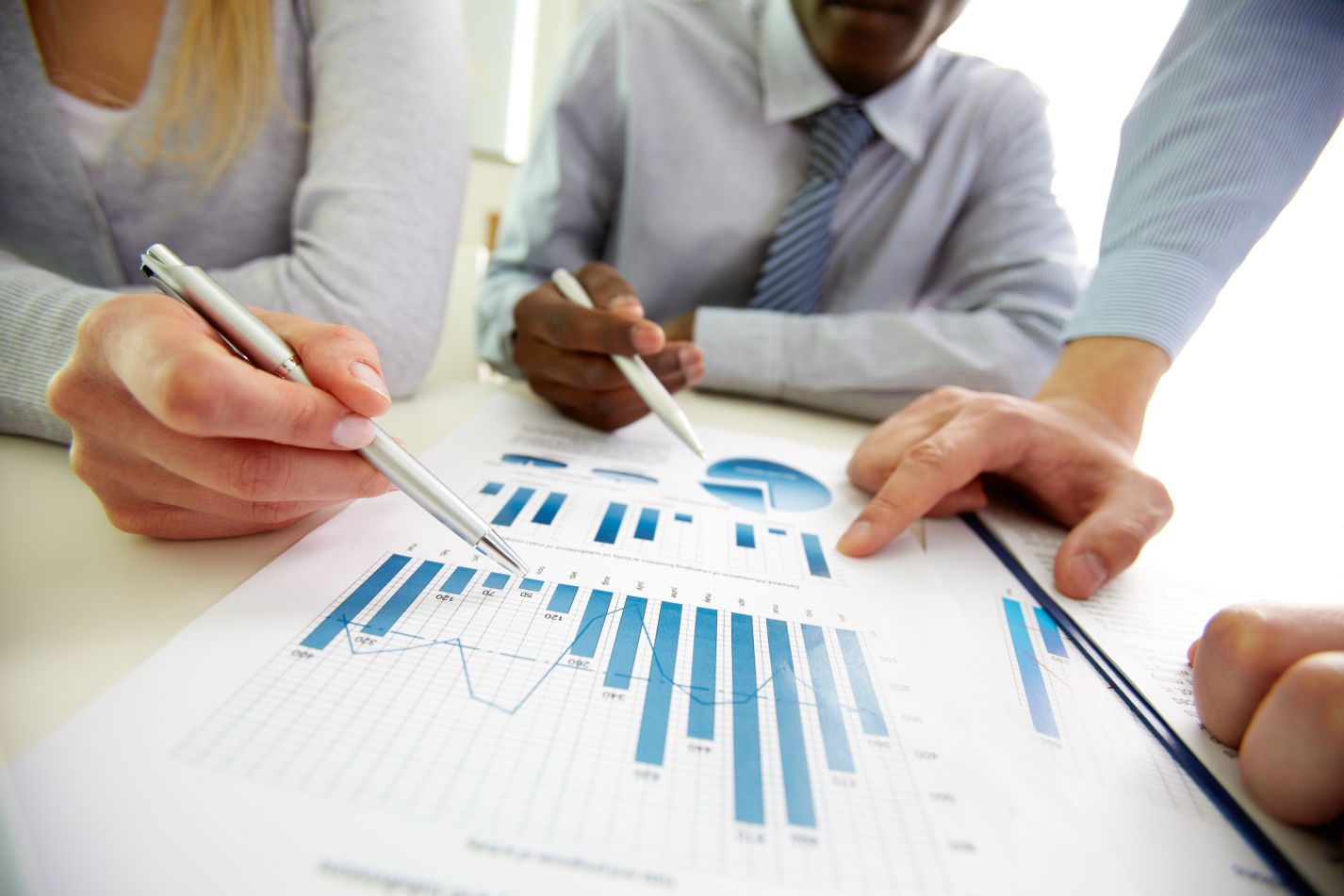 business_people_reviewing_spreadsheet